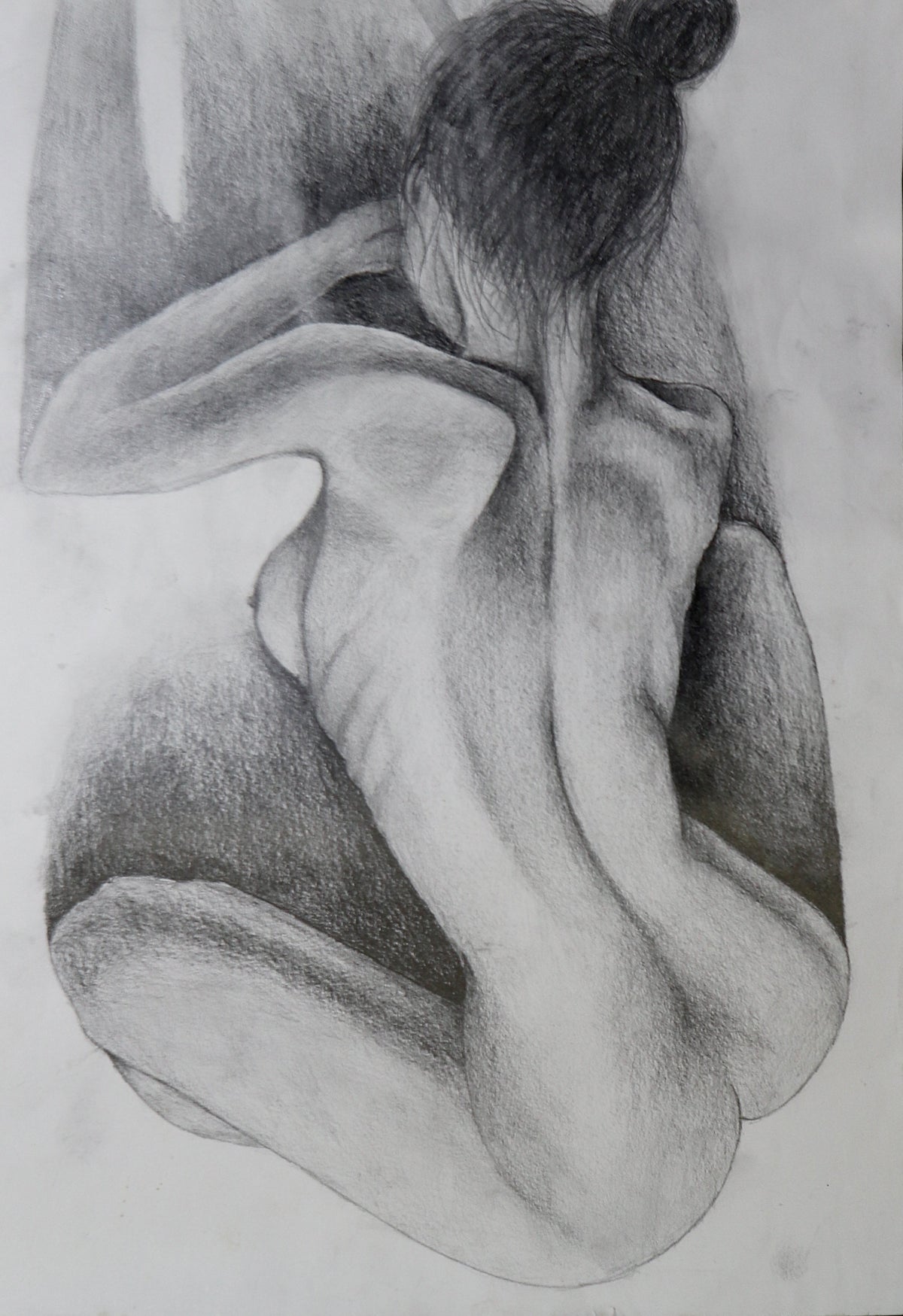 Original pencil drawing on A3 paper — aerial view of seated figure, spine and shoulders